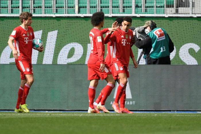 Bayern Munich Jamal Musiala (R) celebrates scoring against Wolfsburg on Saturday