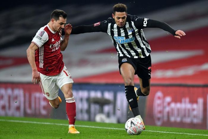 Newcastle striker Joelinton (R)