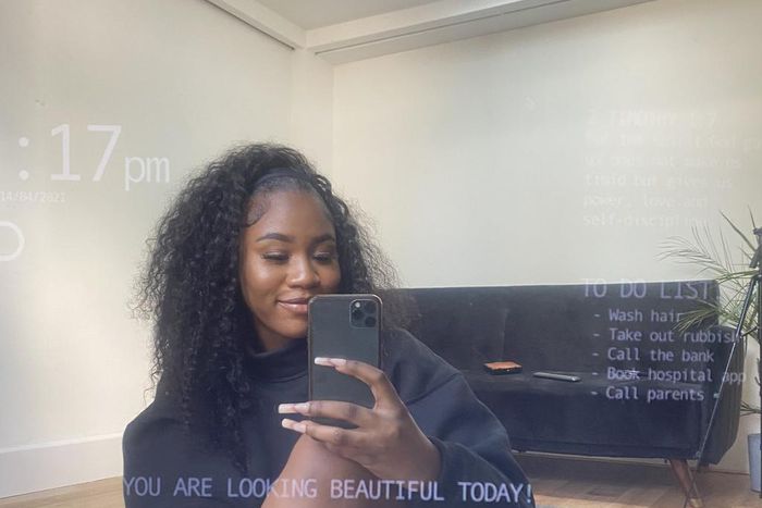 Girlfriend sitting in front of the mirror