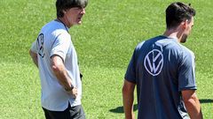 Germany coach Joachim Loew (L) talks to Mats Hummels in training on Thursday