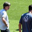 Germany coach Joachim Loew (L) talks to Mats Hummels in training on Thursday