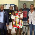 Kwaku Manu with Funny Face's family