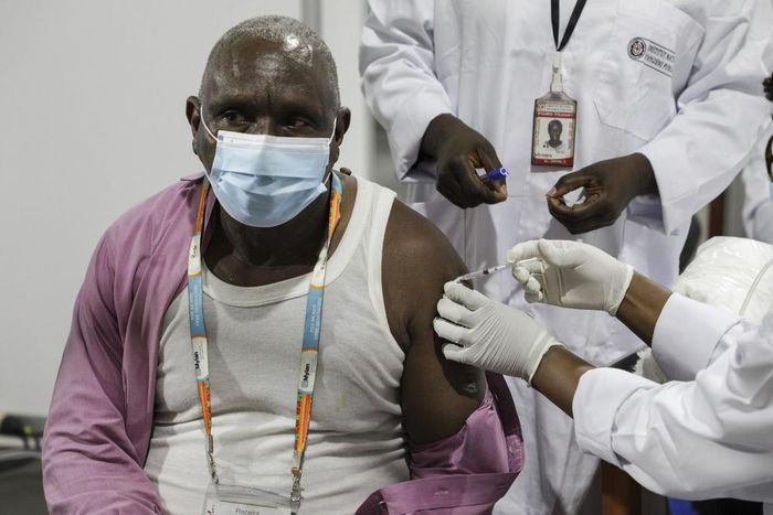 A man gets a coronavirus vaccine in the Ivory Coast with a shot secured through the COVAX scheme.
