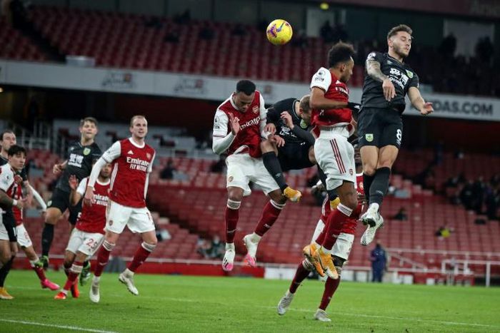 Pierre-Emerick Aubameyang (2nd R) heads the ball into his own net to gift Burnley a 1-0 Premier League win at Arsenal.