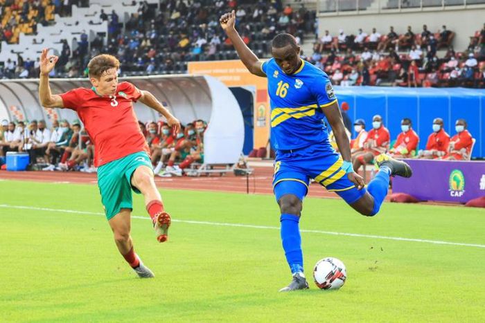 Abdelkarim Baadi (L) of Morocco attempts to block a cross by Ernest Sugira of Rwanda during  an African Nations Championship match in Douala Friday.
