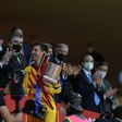 Lionel Messi collects the Spanish Copa del Rey after Barcelona's 4-0 win over Athletic Bilbao in April