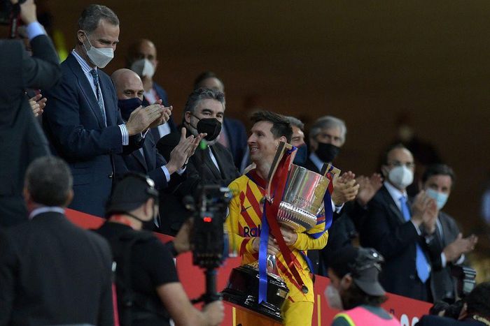 Lionel Messi collects the Spanish Copa del Rey after Barcelona's 4-0 win over Athletic Bilbao in April