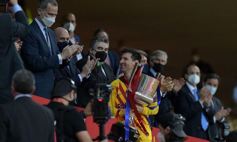 Lionel Messi collects the Spanish Copa del Rey after Barcelona's 4-0 win over Athletic Bilbao in April