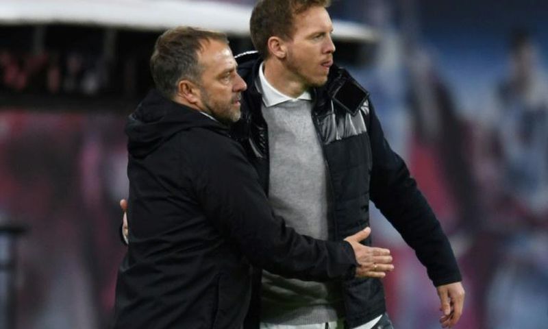 Leipzig head coach Julian Nagelsmann (R) hopes to put pressure on Bayern Munich and their boss Hansi Flick (L)