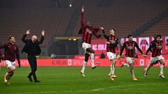 AC Milan's Italian coach Pioli (2ndL) celebrates with his players after holding onto top spot in Serie A