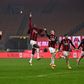 AC Milan's Italian coach Pioli (2ndL) celebrates with his players after holding onto top spot in Serie A