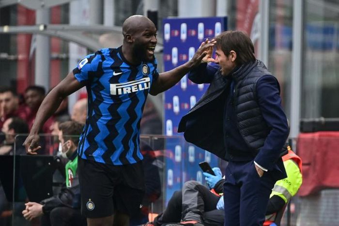 Romelu Lukaku (L) celebrates with coach Antonio Conte during Inter's victory in the Milan derby that put them four points clear at the top of Serie A