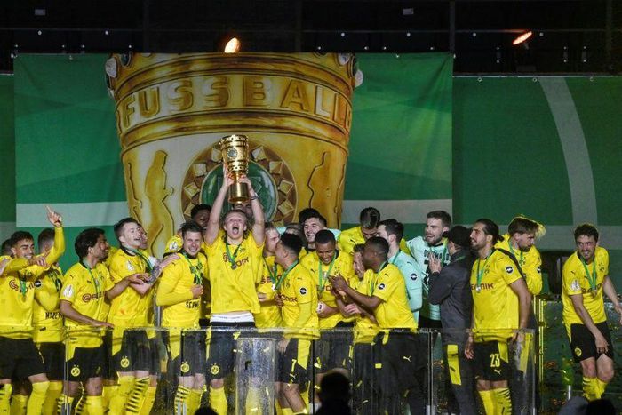 Erling Braut Haaland lifts the trophy after Dortmund won the German Cup final on Thursday