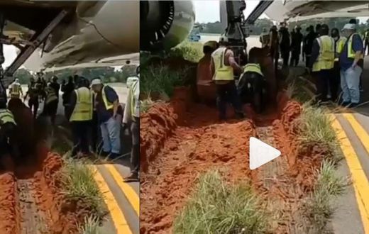 Airplane gets stuck in mud after skidding off the runway
