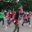 Atletico Madrid's players celebrate outside the Jose Zorilla Stadium after winning La Liga on Saturday.