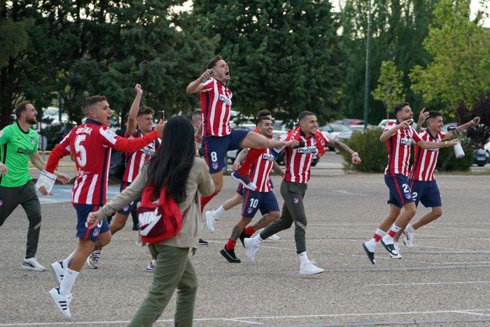 Atletico Madrid's players celebrate outside the Jose Zorilla Stadium after winning La Liga on Saturday.