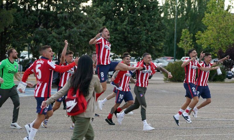Atletico Madrid's players celebrate outside the Jose Zorilla Stadium after winning La Liga on Saturday.