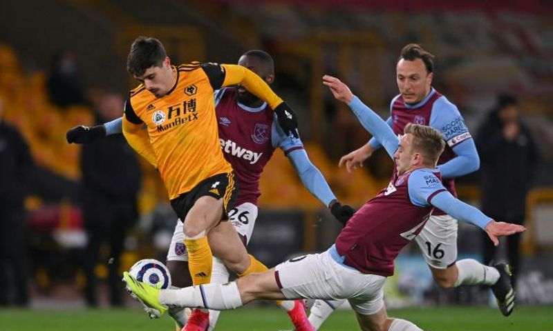 Sidelined - Wolves midfielder Pedro Neto (L)