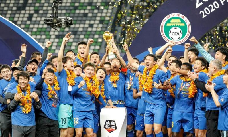 Jiangsu Suning celebrate beating Guangzhou Evergrande to win the Chinese Super League last month, but both clubs may have to change their names for next season