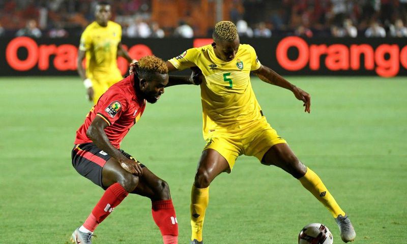 Golden Arrows defender Divine Lunga (R) playing for Zimbabwe against Uganda during the 2019 Africa Cup of Nations in Egypt.