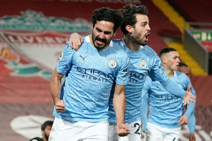 Ilkay Gundogan (left) scored twice at Anfield as Manchester City beat Liverpool 4-1