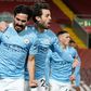 Ilkay Gundogan (left) scored twice at Anfield as Manchester City beat Liverpool 4-1