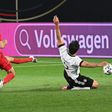 Denmark forward Yussuf Poulsen (L) scores the equaliser against Germany