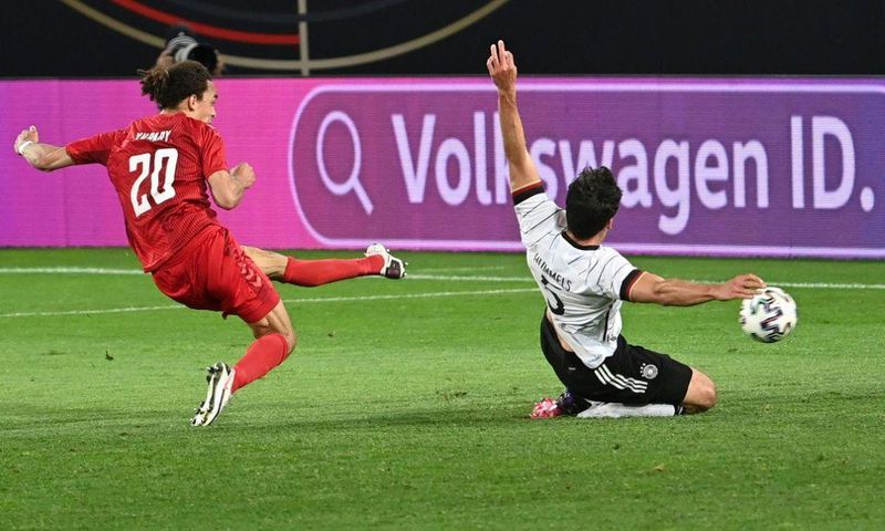 Denmark forward Yussuf Poulsen (L) scores the equaliser against Germany