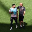 Manchester City's Sergio Aguero with coach Pep Guardiola at a training session on Friday