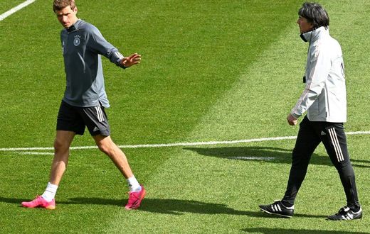 Thomas Mueller (L) is expected to make his first Germany appearance for nearly three years in Wednesday's friendly against Denmark