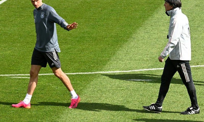 Thomas Mueller (L) is expected to make his first Germany appearance for nearly three years in Wednesday's friendly against Denmark