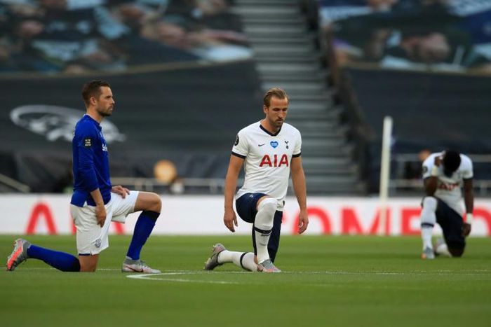 England and Tottenham striker Harry Kane (centre) takes a knee to highlight the issue of racial injustice
