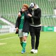 US forward Joshua Sargent (L) is comforted after Werder Bremen were relegated from the Bundesliga on Saturday