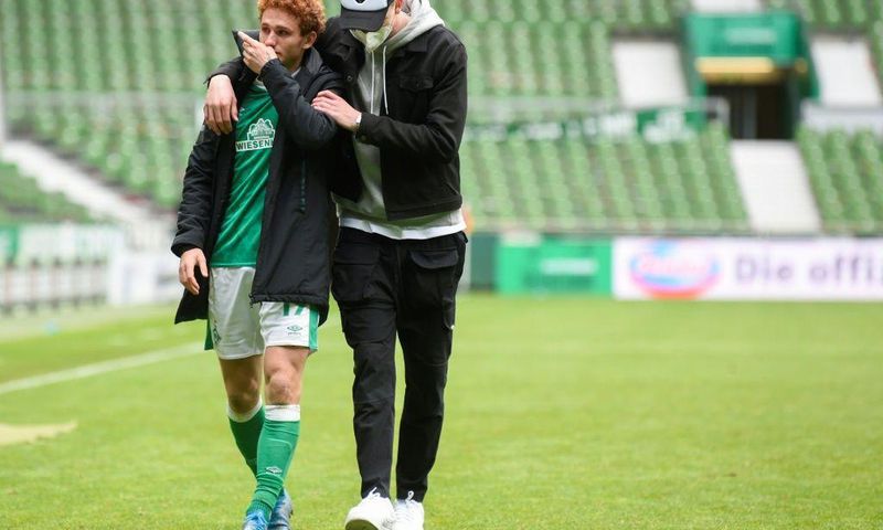 US forward Joshua Sargent (L) is comforted after Werder Bremen were relegated from the Bundesliga on Saturday