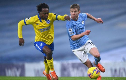 South Africa star Percy Tau (L) playing for Brighton against Manchester City in the English Premier League last season.