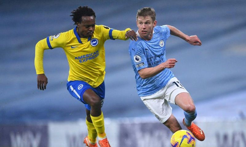 South Africa star Percy Tau (L) playing for Brighton against Manchester City in the English Premier League last season.