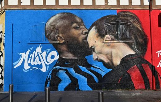 A street art mural near the San Siro stadium of AC Milan's Zlatan Ibrahimovic going head-to-head with Inter Milan's Romelu Lukaku.