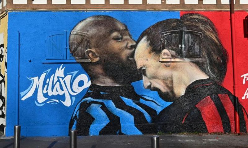 A street art mural near the San Siro stadium of AC Milan's Zlatan Ibrahimovic going head-to-head with Inter Milan's Romelu Lukaku.