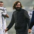 Andrea Pirlo (R) celebrates his first  coaching trophy as Juventus beat Napoli in the Italian Super Cup.