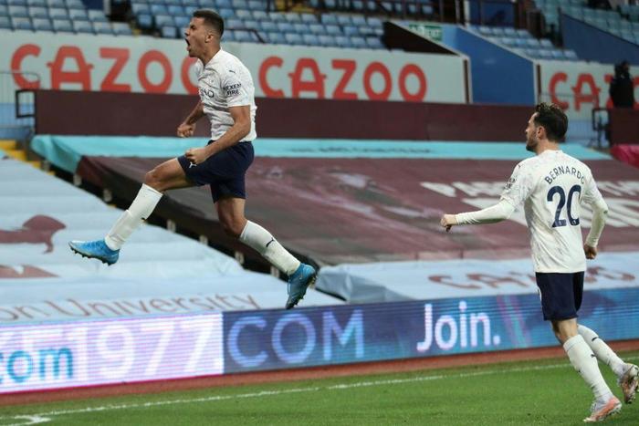Manchester City midfielder Rodri celebrates scoring at Aston Villa