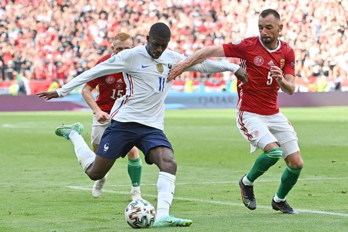 France's forward Ousmane Dembele (L) and Hungary's defender Attila Fiola vie during the UEFA EURO 2020 Group F football match between Hungary and France at Puskas Arena in Budapest on June 19, 2021.