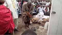 Apam fetish priest performing the rites