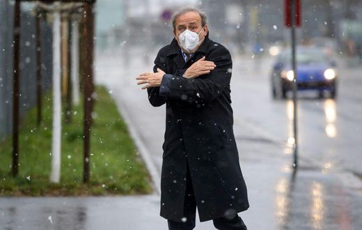 Coing out of the cold:  Michel Platini, attending a hearing with prosecutors in Switzerland in March, is returning to football administration