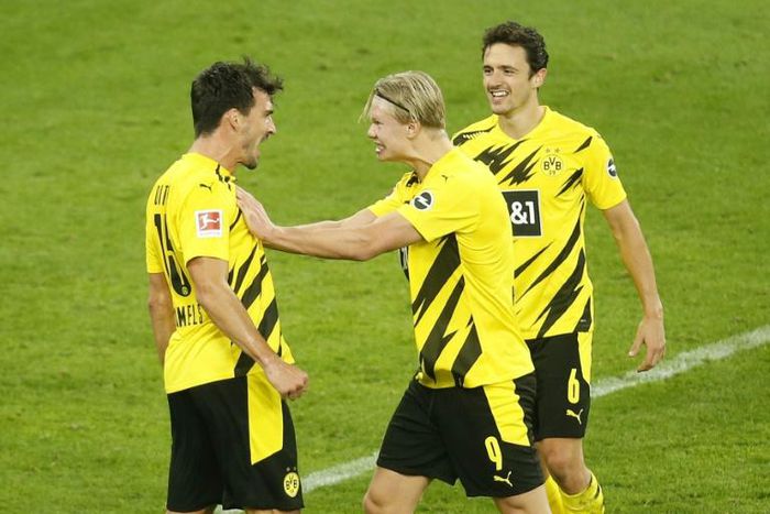 Dortmund striker Erling Braut Haaland (C) is out until January with a torn muscle, but defender Mats Hummels (L) says his ankle injury is not serious