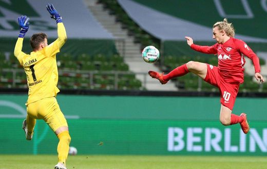 Emil Forsberg (R) scores the winning goal in Friday's German Cup semi-final