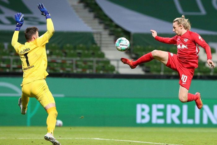 Emil Forsberg (R) scores the winning goal in Friday's German Cup semi-final
