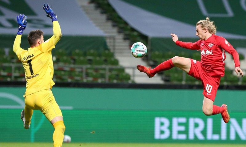 Emil Forsberg (R) scores the winning goal in Friday's German Cup semi-final