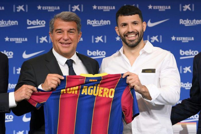 Sergio Aguero (right) was unveiled as a Barcelona player by club president Joan Laporta