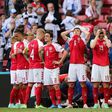 Denmark's distraught players form a ring as paramedics attend to Christian Eriksen after his collapse