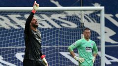 Liverpool goalkeeper Alisson Becker (left)dedicated his winning goal over West Brom to his late father
